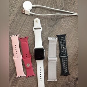 Series 3, Apple Watch with bands and charger.